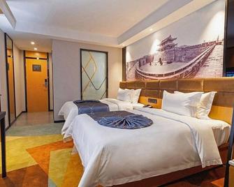 Chonpines Hotel Jingzhou Ancient City Wanda - Jingzhou - Schlafzimmer
