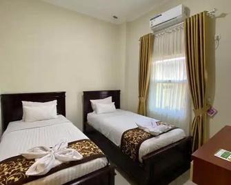 Qieran Hotel Syariah - Bengkulu City - Bedroom