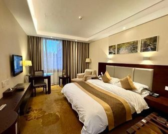 Lotus Hotel - קונמינג - חדר שינה