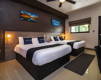 Collection O Hotel Mango,Six Flags Hurricane Harbor Oaxtepec - Oaxtepec - Спальня