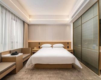 Yajiada Hotel (Zhangzhou Wanda Plaza) - Zhangzhou - Bedroom