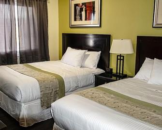 Skyland Motel Inn & Suites - Huntsville - Bedroom
