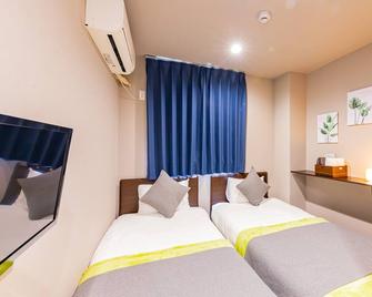 جا هوتل شينفوكاي - أوساكا - غرفة نوم