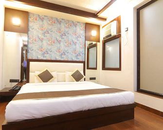 Hotel Grand Sparrow Inn - Agra - Schlafzimmer