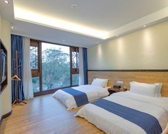 Pingle Ancient Town Lijiang Hostel - Chengdu - Sypialnia
