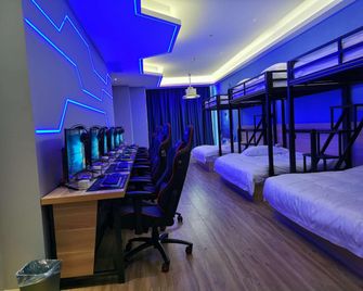 Zhongxiu Esports Hotel (Huanggang Normal University Branch) - Huanggang - Bedroom