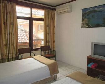 Hotel Grand Pirus Samarinda - Samarinda - Bedroom