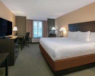 Days Inn & Suites by Wyndham Florence/Jackson Area - Florence - Bedroom
