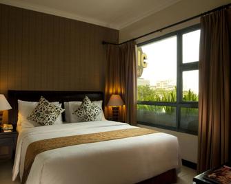 Grand Tropic Suites Hotel - Jakarta - Slaapkamer