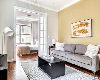 Sunny West Village 2BR w/ W/D, near 8th Ave Subway, by Blueground - New York - Living room