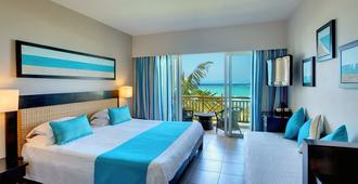 Pearle Beach Resort & Spa - Flic en Flac - Makuuhuone