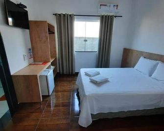 Pousada Limas Suites - Capitólio - Habitación