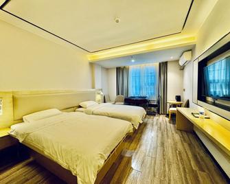 Guilin Tree Hotel - גילין - חדר שינה