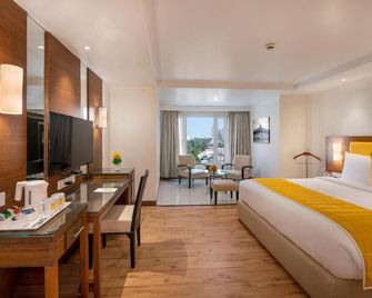 Country Inn & Suites By Carlson - Ahmedabad - אחמדאבאד - חדר שינה