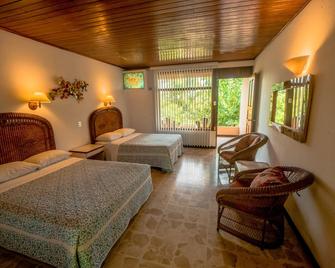 Karahe Beach Hotel - מנואל אנטוניו - חדר שינה