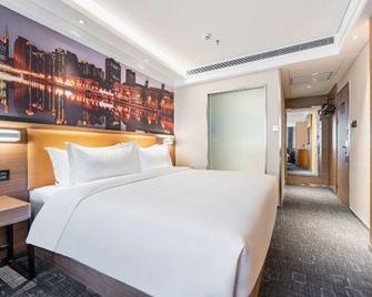 Super 8 by Wyndham Lanzhou Yan Tan - לנג'ואו - חדר שינה