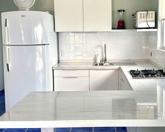 Your peaceful sea-side escape - Sabana Westpunt - Kitchen