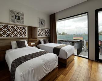 Mulia Hotel Syariah - Bukittinggi - Bedroom