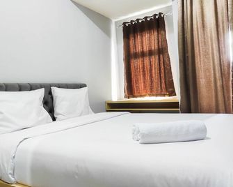 Comfy and Minimalist Studio at Vida View Apartment By Travelio - Makassar - Habitación