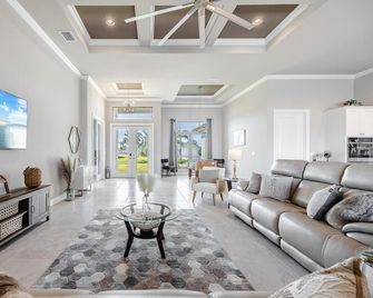 Foosball, Outdoor Grilling Station, Pool and Spa, Canal Views - Salted Air Villa - Roelens Vacations - Matlacha - Living room
