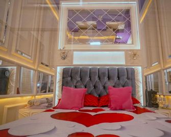 The One Hotel Gorontalo Mitra RedDoorz - Gorontalo - Ložnice