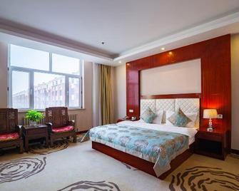 Qianqiu Holiday Hotel Xilinhot - Xilin Gol - Bedroom