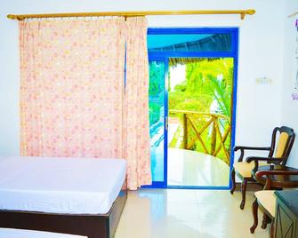 Coconut Marumbi Apartments - Uroa - Bedroom