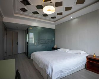 Xincheng Yangguang Business Apartment - Harbin - Sypialnia