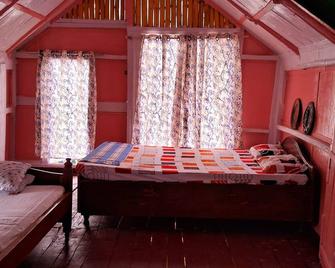 “Elevated wood cabin and bamboo lounge combo in a lush mountain valley.” - Guwahati