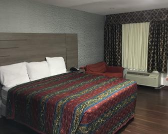 Travel Inn - Humble - Bedroom