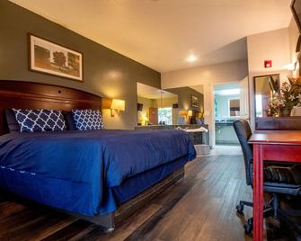 Magnolia Inn and Suites - Magnolia - Bedroom