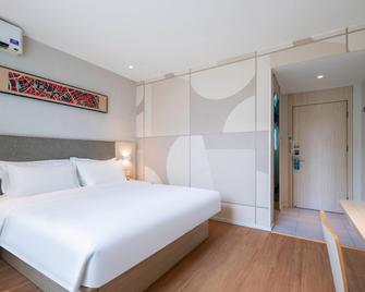 Hanting Hotel Qingdao Taitung Weihai Road - تشينغداو - غرفة نوم