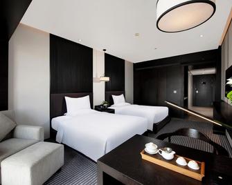 شيان إيسترن هاوس بوتيك هوتل - زيان - غرفة نوم