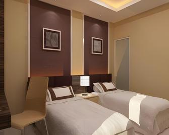 Lynt Hotel Jakarta - Yakarta - Habitación