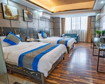Zhangjiajie Mr.F Boutique Hotel (Tianmen Mountain Cableway Station) - ג'אנגג'יאיי - חדר שינה
