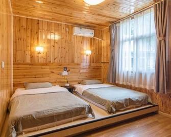 Xi Chang Blooming Azalea Hostel - Liangshan - Slaapkamer