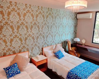 Park Hotel Rakurakuen - Maebashi - Slaapkamer