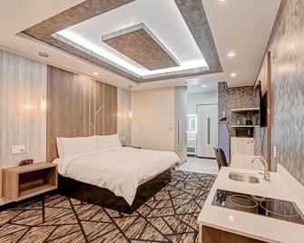 SureStay Hotel by Best Western Houston Southeast - South Houston - Bedroom