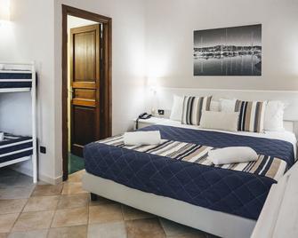 Hotel Le Rose - San Teodoro - Slaapkamer