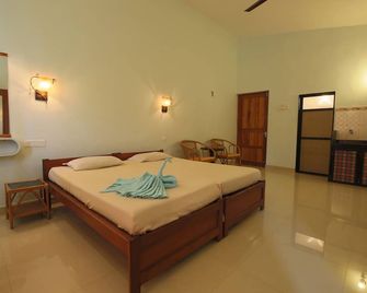 Sea Pearl Guesthouse - Candolim - Soverom