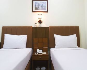 House of Arsonia Tulip - ג'קרטה - חדר שינה