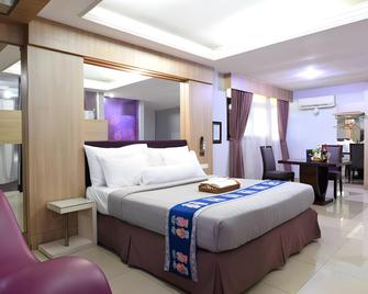 C'One Pulomas Hotel - Jakarta - Bedroom