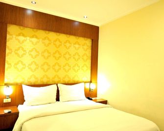 G-Hotel Pontianak - Pontianak - Schlafzimmer