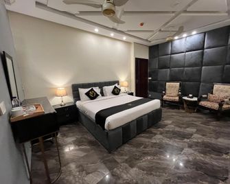Palm Tree Hotel - Lahore - Slaapkamer