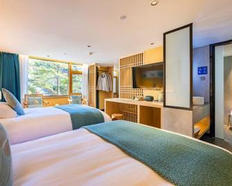 Huangshan Baiyun Hotel - Huangshan - Schlafzimmer