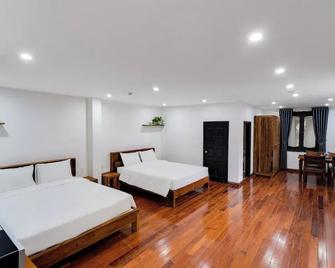 An Suites - Hanoi - Schlafzimmer