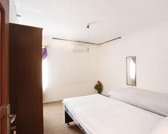 Hotel O Penginapan Budhe Sri - Samarinda - Ložnice