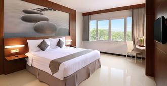 Hotel Neo Palma Palangkaraya By Aston - Palangkaraya - Bedroom