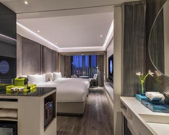 Novotel Yangzhou City Center - Yangzhou - Slaapkamer