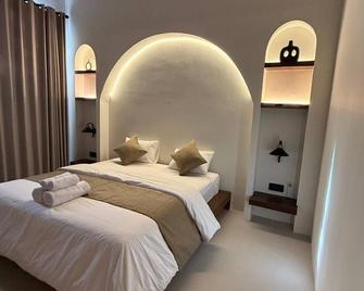 Malasama suites hotel - Kuta - Schlafzimmer